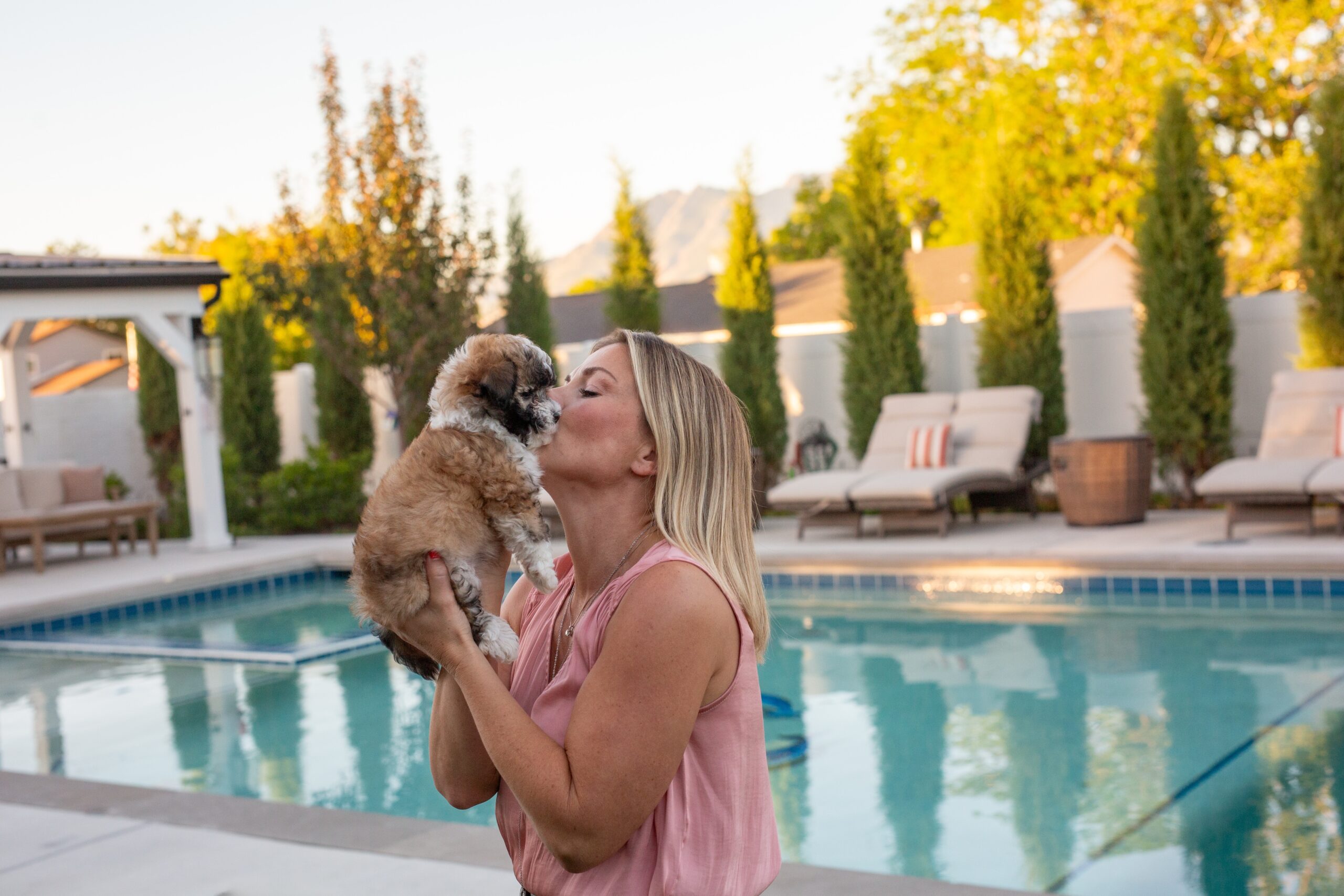 Small Sage Puppies puppy held gently in South Jordan Utah